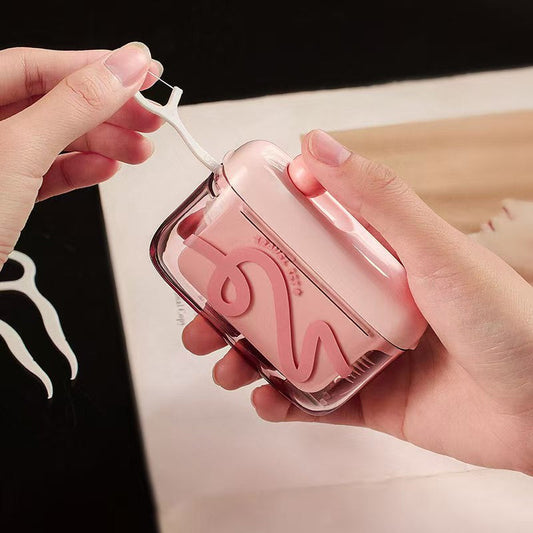 Dispensador automático emergente para guardar hilo dental