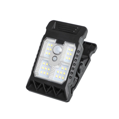 Lámpara solar de exterior con clip y sensor de movimiento.